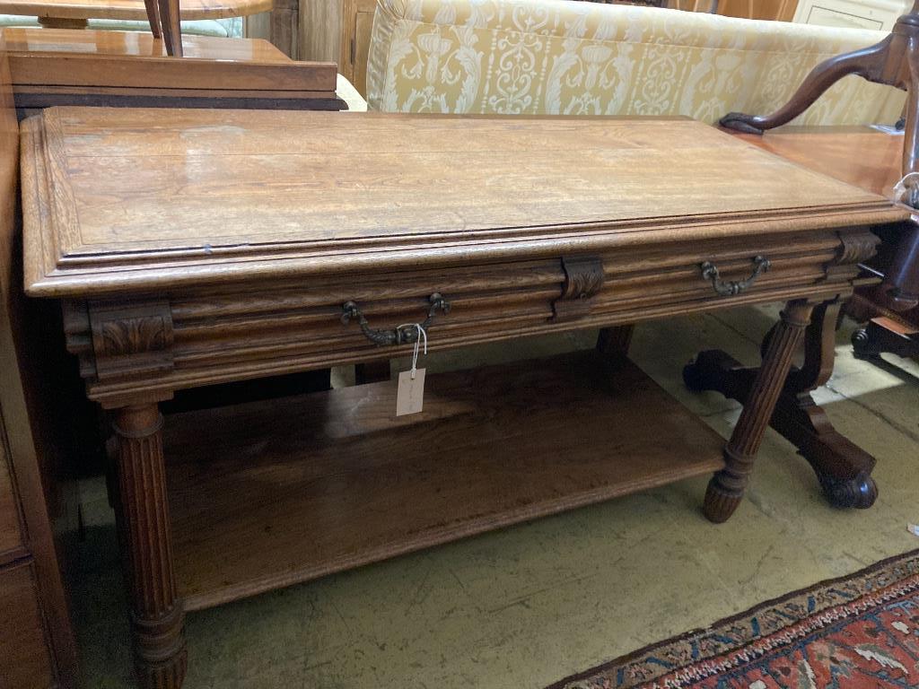 A 19th century French oak two-tier side table, length 130cm, depth 55cm, height 73cm